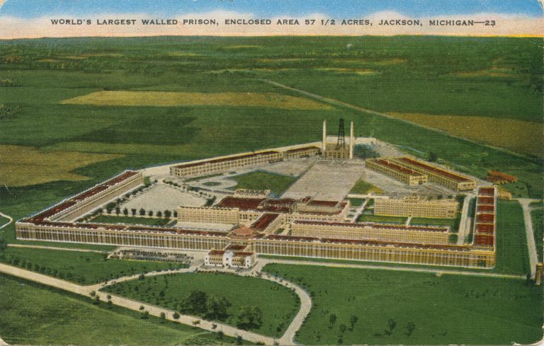 Bird's eye view illustration showing Jackson Prison and it's 5-sided wall, amidst vast fields of green.