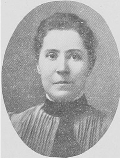 Black and white portrait of a women with her hair pulled back and wearing a dark collar.